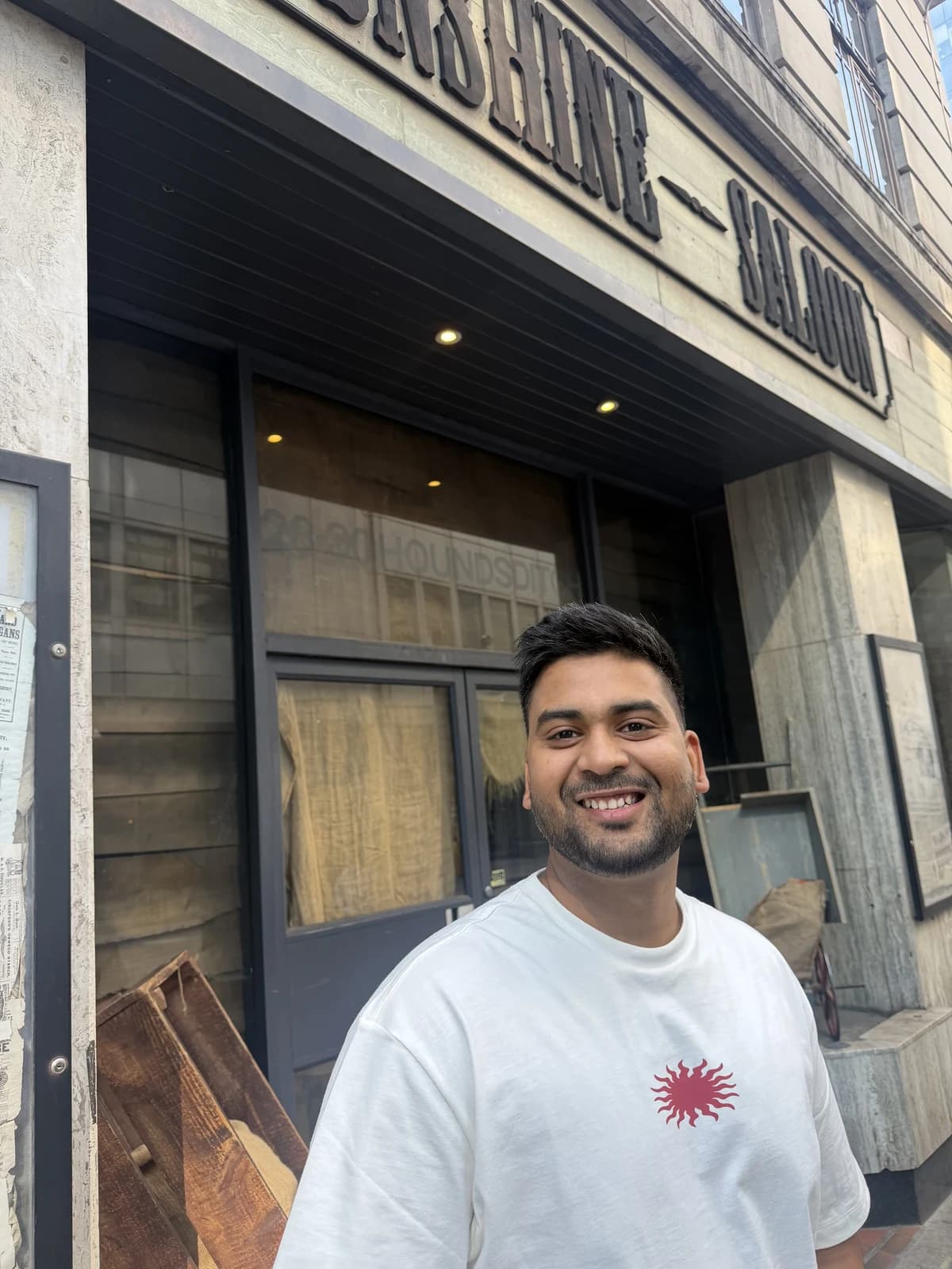 Sudhanshu Verma smiling outside a building